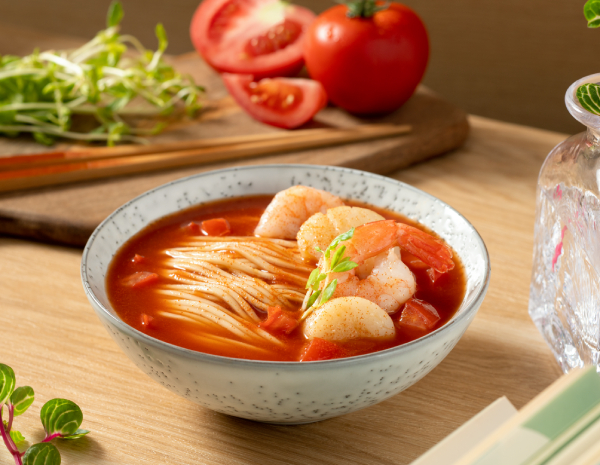 Noodles in spicy tomato soup with seafood